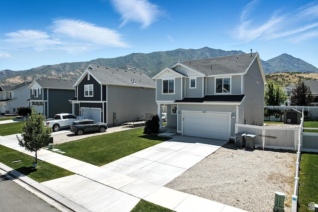 1017 S Red Cliff Dr, Santaquin, UT 84655 - traditional-style home featuring a mountain view, driveway, and an attached garage