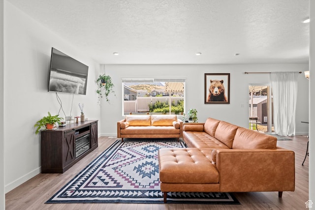1017 S Red Cliff Dr, Santaquin, UT 84655 - living area with a textured ceiling, wood finished floors, and recessed lighting