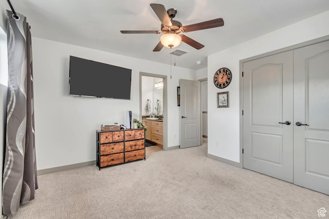 11874 S Rushmore Park Ln W, Herriman, UT 84096 - bedroom with light carpet, a closet, a ceiling fan, and ensuite bathroom