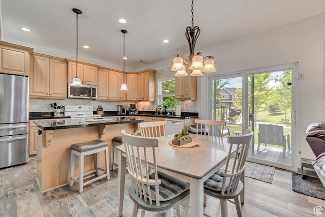 11874 S Rushmore Park Ln W, Herriman, UT 84096 - dining area with a chandelier, light wood-style floors, and recessed lighting