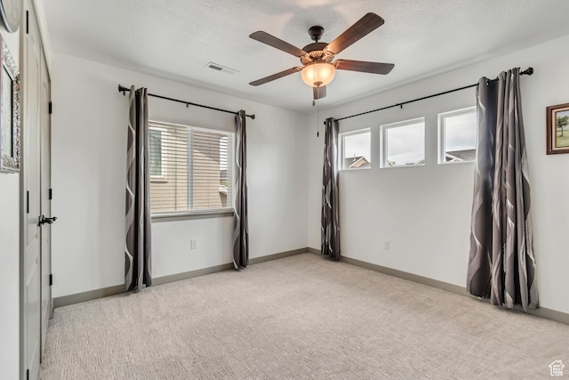 11874 S Rushmore Park Ln W, Herriman, UT 84096 - unfurnished room featuring a ceiling fan, healthy amount of natural light, and carpet flooring