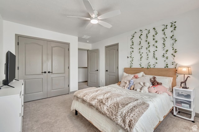 11874 S Rushmore Park Ln W, Herriman, UT 84096 - bedroom with light carpet, a ceiling fan, and a closet
