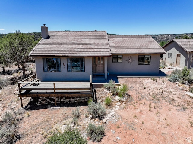 1387 N Mount Zion Dr, Apple Valley, UT 84737 - view of front of house with a chimney, stucco siding, and a tile roof