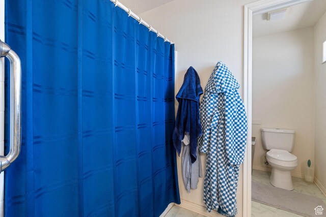 1387 N Mount Zion Dr, Apple Valley, UT 84737 - full bathroom with toilet and marble look tile flooring