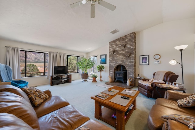 1387 N Mount Zion Dr, Apple Valley, UT 84737 - carpeted living area featuring vaulted ceiling, a wood stove, and ceiling fan