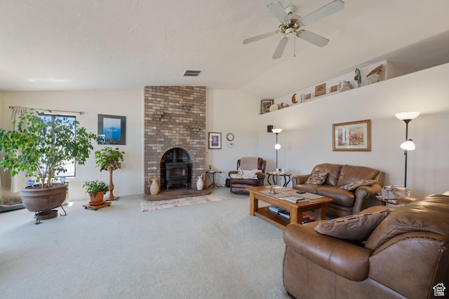 1387 N Mount Zion Dr, Apple Valley, UT 84737 - living area with lofted ceiling, carpet floors, a wood stove, and a ceiling fan
