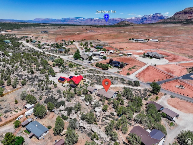 1387 N Mount Zion Dr, Apple Valley, UT 84737 - aerial view of property and surrounding area featuring a mountainous background and rural landscape