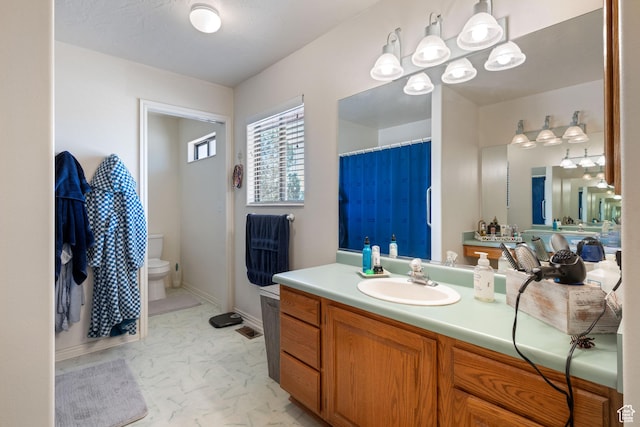 1387 N Mount Zion Dr, Apple Valley, UT 84737 - bathroom featuring a chandelier, vanity, a shower with curtain, and marble finish flooring