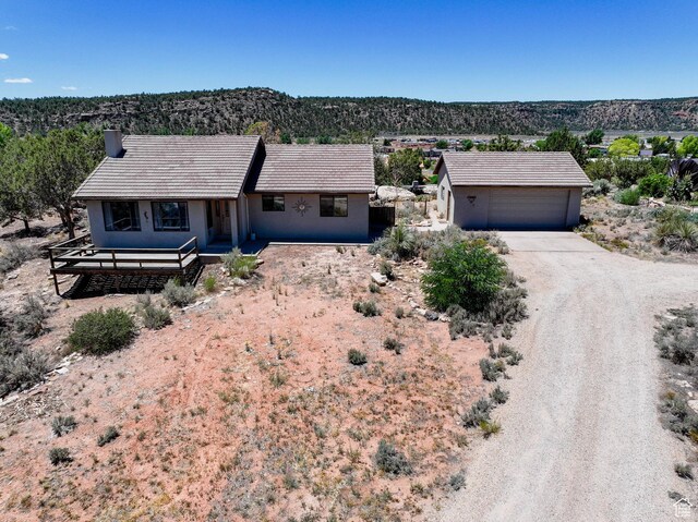 1387 N Mount Zion Dr, Apple Valley, UT 84737 - ranch-style home with dirt driveway and stucco siding