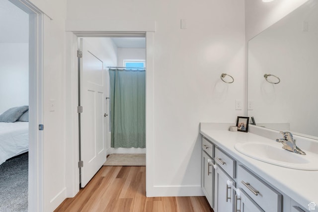 1831 W Newcastle Ln Unit 101, Saratoga Springs, UT 84045 - ensuite bathroom with vanity and wood finished floors