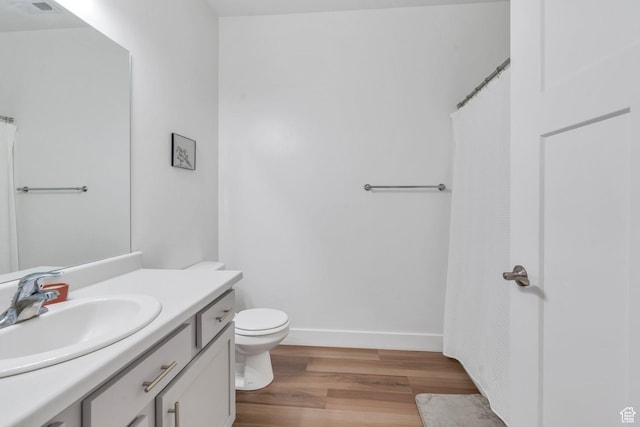 1831 W Newcastle Ln Unit 101, Saratoga Springs, UT 84045 - bathroom featuring vanity, wood finished floors, and a shower with shower curtain
