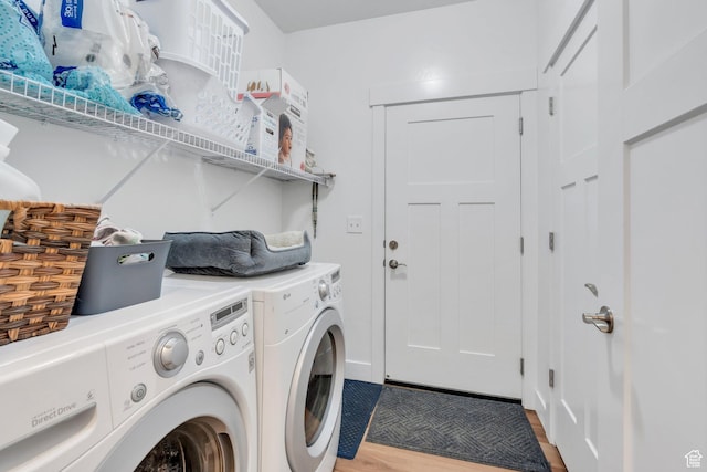 1831 W Newcastle Ln Unit 101, Saratoga Springs, UT 84045 - washroom with washing machine and clothes dryer and wood finished floors