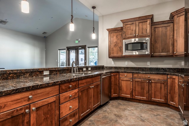 13602 N Hillclimb Ln, Kamas, UT 84036 - kitchen featuring appliances with stainless steel finishes, dark stone counters, hanging light fixtures, high vaulted ceiling, and dark tile patterned floors