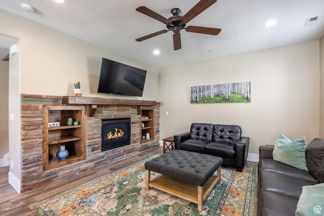 13602 N Hillclimb Ln, Kamas, UT 84036 - living area with wood finished floors, ceiling fan, a stone fireplace, and recessed lighting