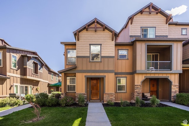 13602 N Hillclimb Ln, Kamas, UT 84036 - view of front of house with board and batten siding, stone siding, and a front lawn