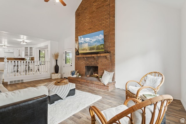 2255 E Camino Way Way S, Cottonwood Heights, UT 84121 - living room with a ceiling fan, high vaulted ceiling, a fireplace, and wood finished floors