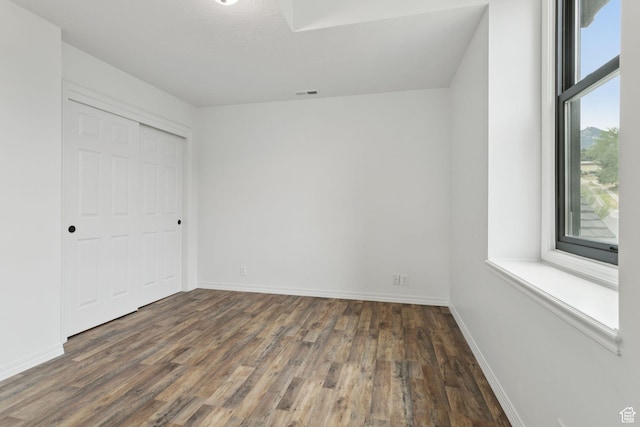 2255 E Camino Way Way S, Cottonwood Heights, UT 84121 - unfurnished bedroom featuring wood finished floors and a closet