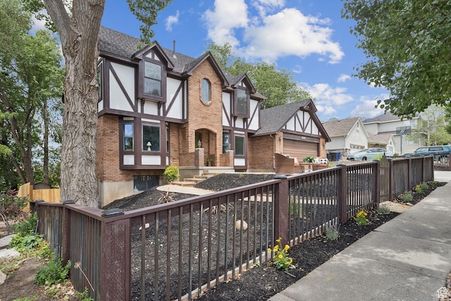 2255 E Camino Way Way S, Cottonwood Heights, UT 84121 - english style home featuring brick siding, a residential view, and a shingled roof