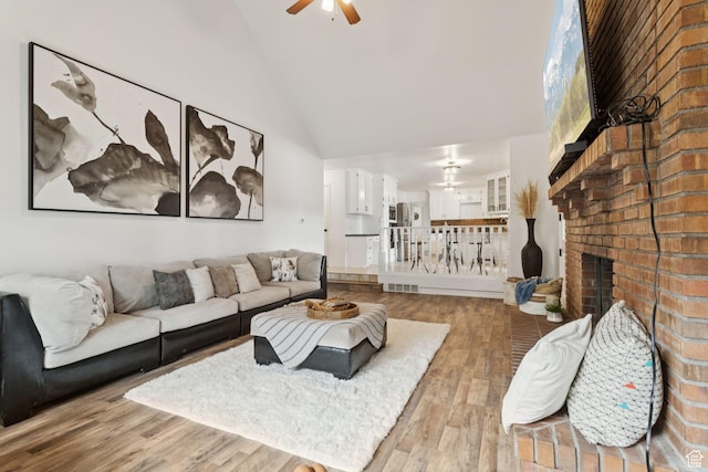 2255 E Camino Way Way S, Cottonwood Heights, UT 84121 - living area featuring a ceiling fan, high vaulted ceiling, wood finished floors, and a fireplace