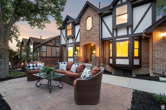 2255 E Camino Way Way S, Cottonwood Heights, UT 84121 - patio terrace at dusk featuring an outdoor living space and a patio area