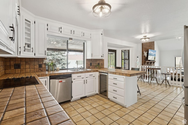 2255 E Camino Way Way S, Cottonwood Heights, UT 84121 - kitchen featuring dishwasher, a peninsula, beverage cooler, decorative backsplash, and black electric stovetop