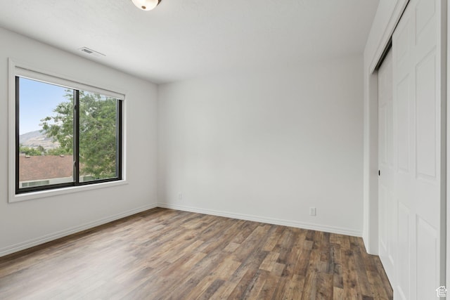 2255 E Camino Way Way S, Cottonwood Heights, UT 84121 - unfurnished bedroom featuring wood finished floors and a closet