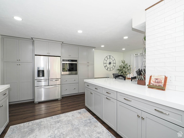 1152 E Gavin Cir, Draper, UT 84020 - kitchen with appliances with stainless steel finishes, gray cabinetry, dark wood-style flooring, and recessed lighting
