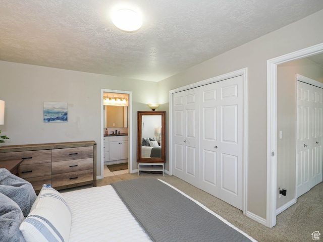 1152 E Gavin Cir, Draper, UT 84020 - bedroom with light carpet, a textured ceiling, connected bathroom, and a closet