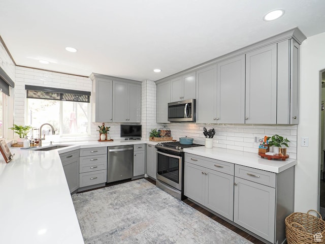 1152 E Gavin Cir, Draper, UT 84020 - kitchen featuring gray cabinets, stainless steel appliances, tasteful backsplash, and recessed lighting