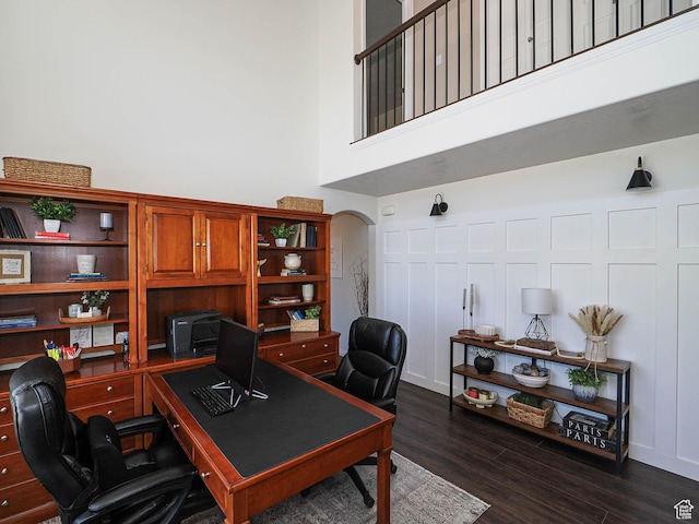 1152 E Gavin Cir, Draper, UT 84020 - office featuring arched walkways, dark wood finished floors, and a towering ceiling