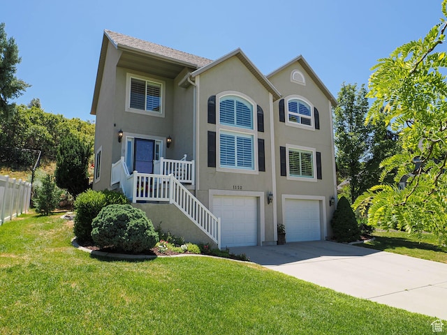 1152 E Gavin Cir, Draper, UT 84020 - view of front facade featuring an attached garage, stucco siding, and concrete driveway