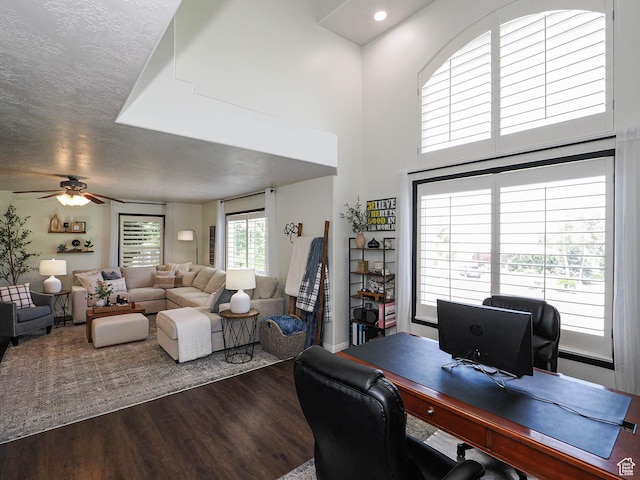 1152 E Gavin Cir, Draper, UT 84020 - home office with dark wood-style flooring, a ceiling fan, and a towering ceiling