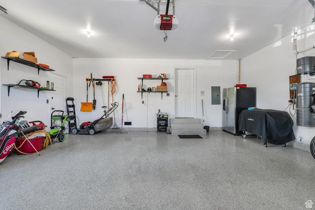 421 S 1400 E, Fruit Heights, UT 84037 - garage with stainless steel fridge with ice dispenser, electric panel, and a garage door opener