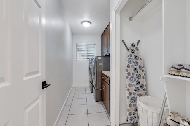 421 S 1400 E, Fruit Heights, UT 84037 - laundry area featuring cabinet space, independent washer and dryer, and light tile patterned floors