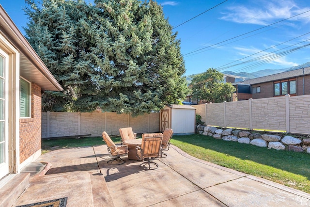 421 S 1400 E, Fruit Heights, UT 84037 - fenced backyard with a patio area, a storage shed, and outdoor dining space