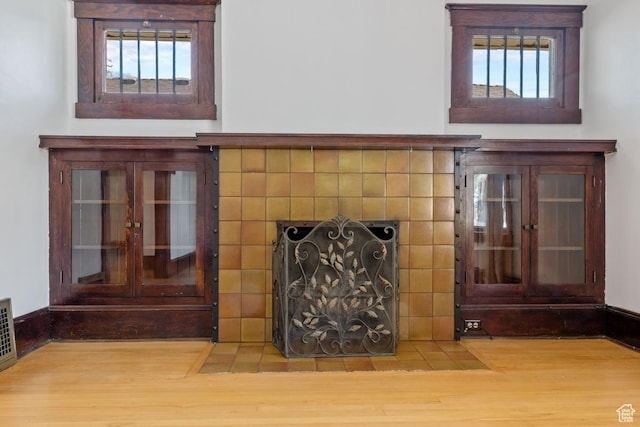 168 N T St E, Salt Lake City, UT 84103 - detailed view of wood finished floors and a tile fireplace