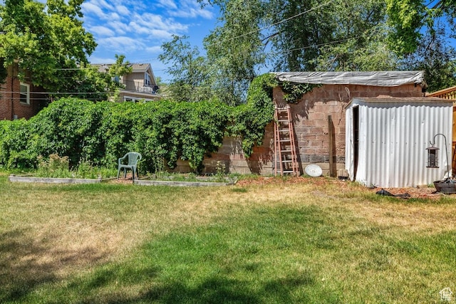 168 N T St E, Salt Lake City, UT 84103 - view of green lawn with a storage shed