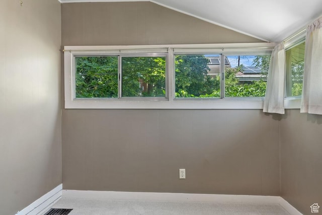 168 N T St E, Salt Lake City, UT 84103 - unfurnished room with vaulted ceiling and carpet flooring