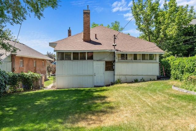 168 N T St E, Salt Lake City, UT 84103 - rear view of house featuring a chimney, a gate, and a shingled roof