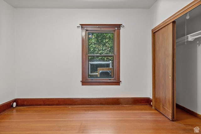 168 N T St E, Salt Lake City, UT 84103 - unfurnished bedroom with wood finished floors and a closet