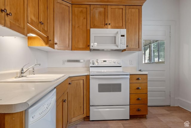168 N T St E, Salt Lake City, UT 84103 - kitchen with white appliances, light countertops, and brown cabinetry