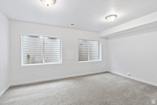 4988 W Currant Dr, South Jordan, UT 84009 - carpeted spare room with baseboards and a textured ceiling