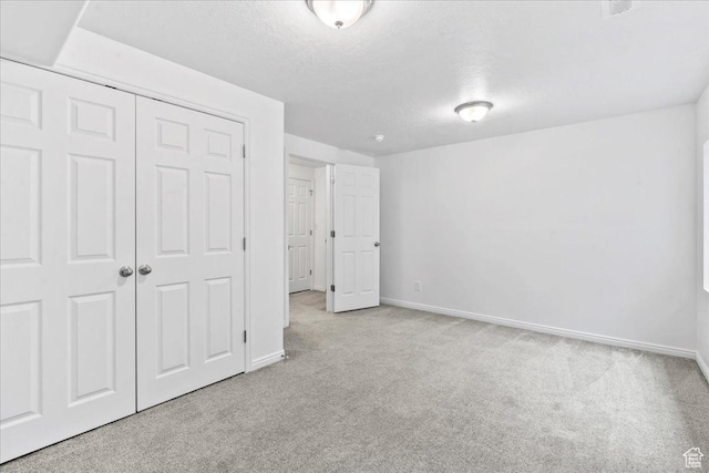 4988 W Currant Dr, South Jordan, UT 84009 - unfurnished bedroom featuring carpet flooring, a closet, and a textured ceiling