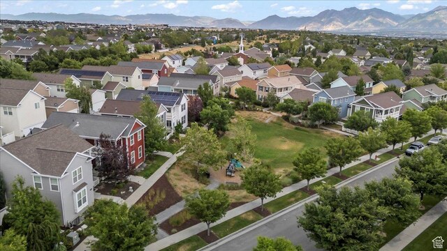 4988 W Currant Dr, South Jordan, UT 84009 - aerial perspective of suburban area featuring a mountainous background