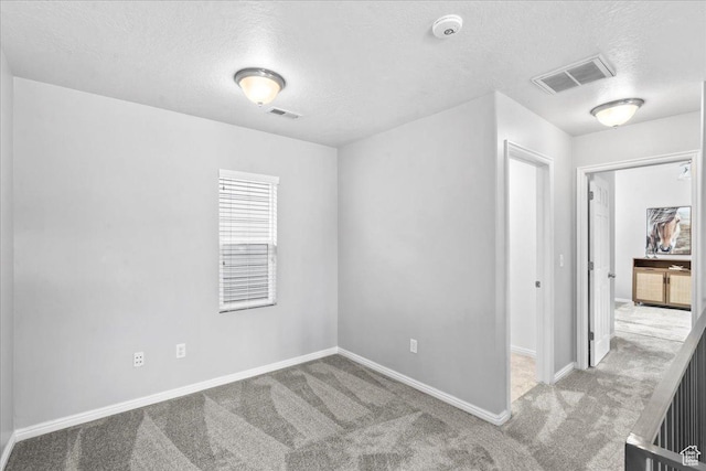 4988 W Currant Dr, South Jordan, UT 84009 - unfurnished room featuring a textured ceiling, carpet floors, and a smoke detector
