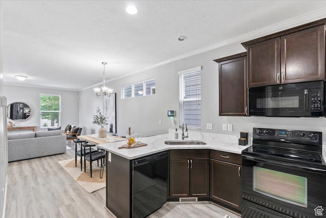 4988 W Currant Dr, South Jordan, UT 84009 - kitchen featuring black appliances, a chandelier, dark brown cabinets, light wood-style flooring, and crown molding