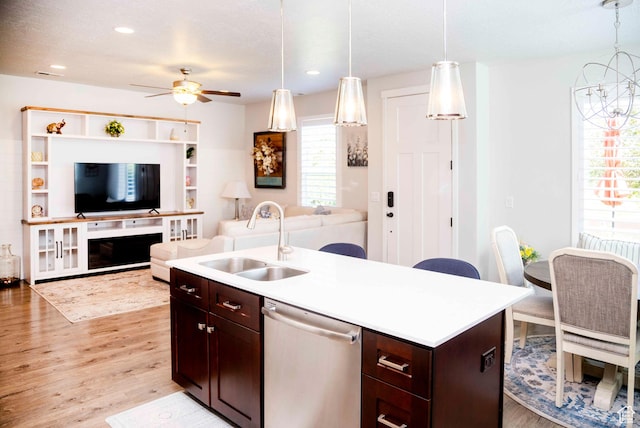 6122 W Lake Ave S, South Jordan, UT 84009 - kitchen with stainless steel dishwasher, open floor plan, light wood finished floors, ceiling fan, and light countertops