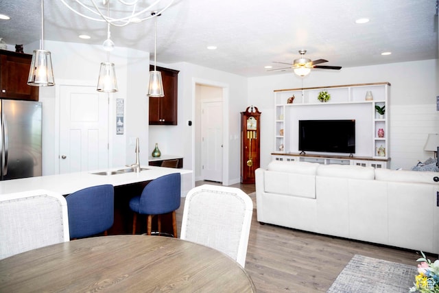 6122 W Lake Ave S, South Jordan, UT 84009 - living room featuring ceiling fan, light wood-type flooring, and recessed lighting