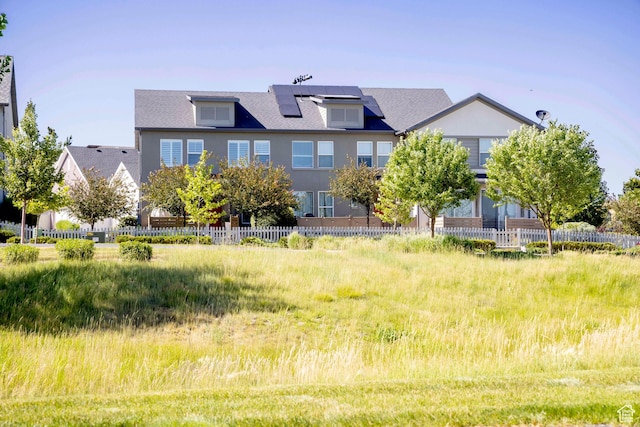 6122 W Lake Ave S, South Jordan, UT 84009 - rear view of property featuring roof mounted solar panels and roof with shingles