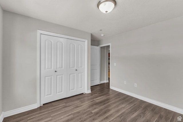 1195 W Dallin Dr Unit 304, Pleasant Grove, UT 84062 - unfurnished bedroom with wood finished floors and a closet